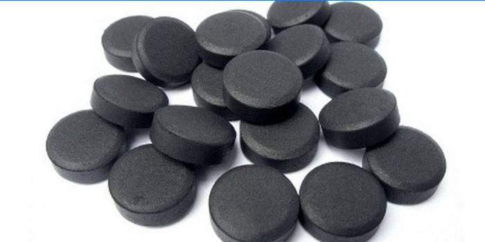 Tabletas de carbón activado negro