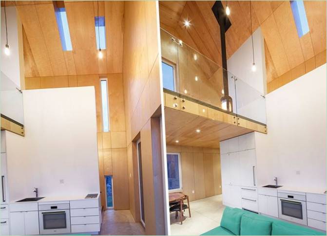 Casa con fachada de madera por Design Base 8: La cocina