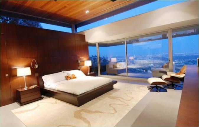 Diseño interior de dormitorio moderno con ventana panorámica