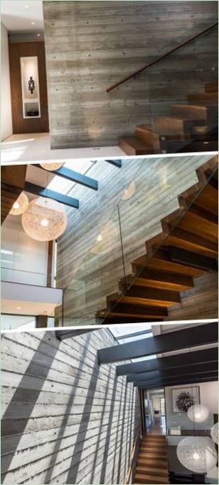 Escalera de madera con barandilla de cristal en California